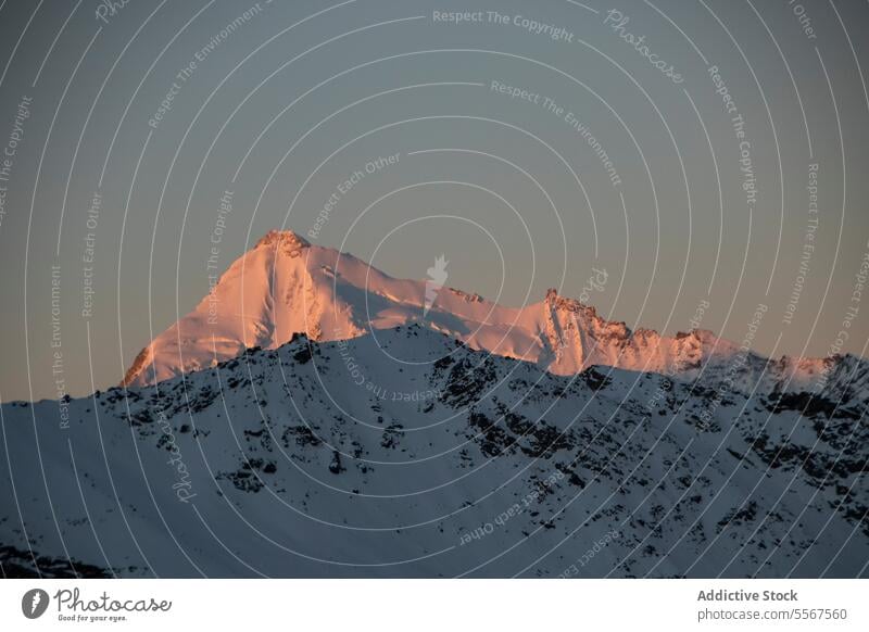 Mountain and landscape covered with snow against blue sky picturesque view sunset mountain range rock covering swiss alps peak top winter cloud natural high