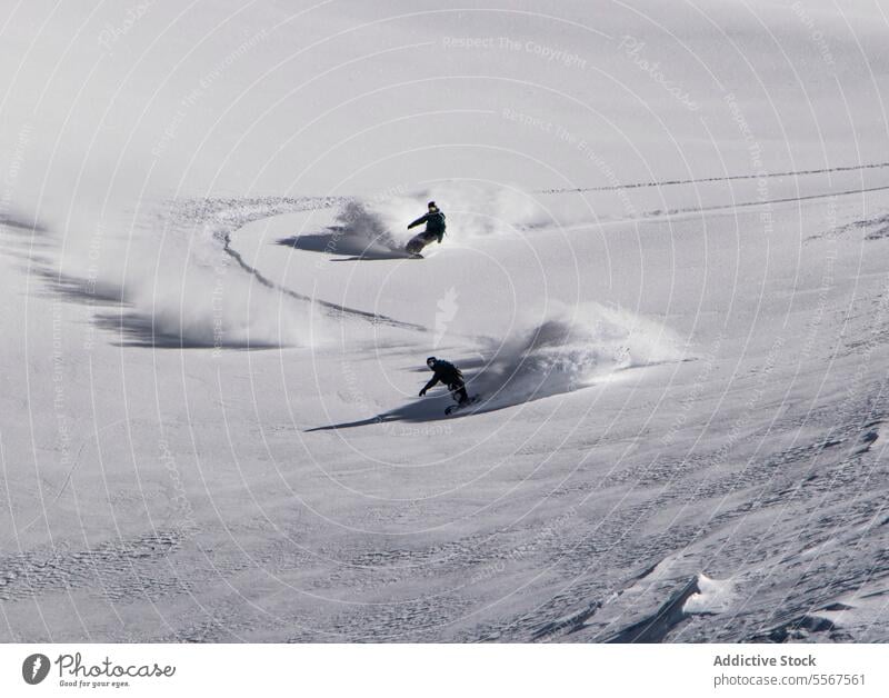 People snowboarding on snow covered landscape during vacation people unrecognizable ski nature mountain equipment snowboarder full body sunny winter lifestyle