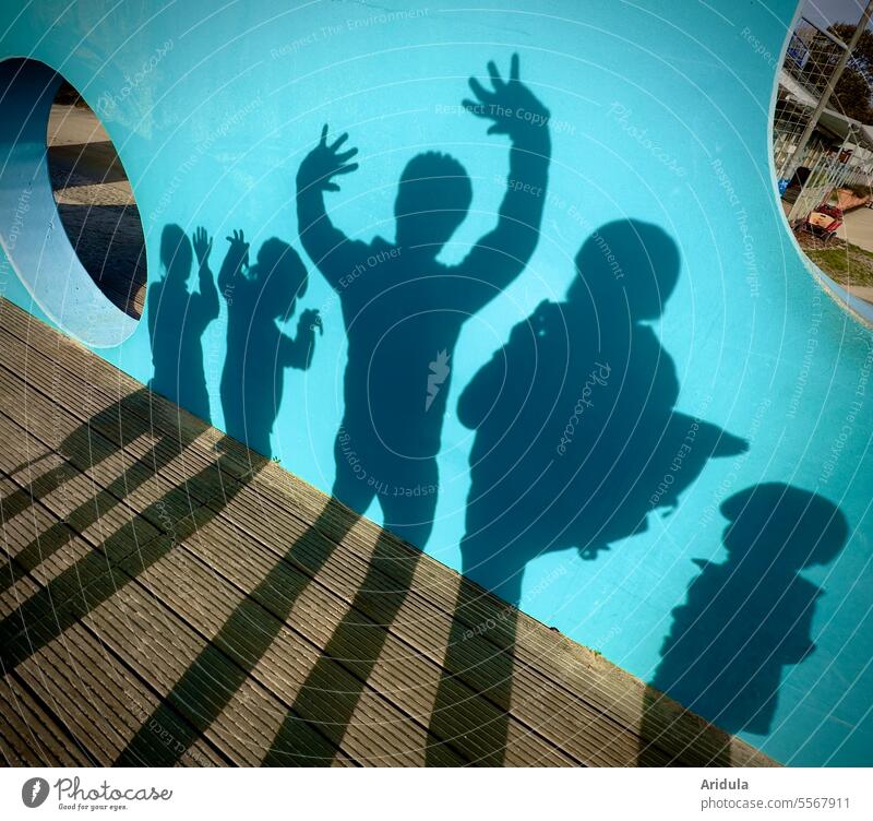 consciousness-raising | shadow family photo Shadow Wall (building) persons people Family Arm Body pose group Adults children Shadow play shadow cast Contrast