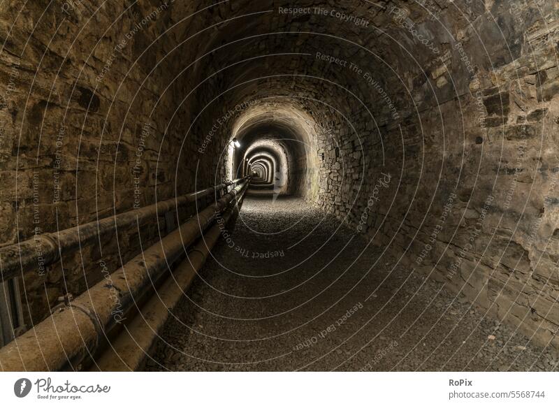 Tunnel in a historic mine. crossing Underpass Train station technique Infrastructure Town tiles stone road urban elevator shaft Escape route Mechanics statics