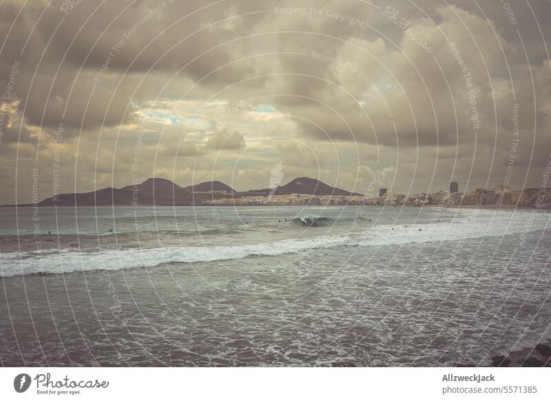 Stormy sea and cloudy sky on the beach of Playa de las Canteras in Las Palmas, Gran Canaria. Las Palmas de Gran Canaria Beach beach promenade Ocean