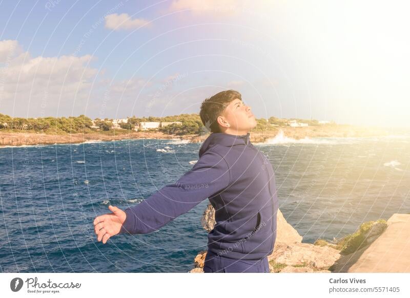 young hispanic with open arms praying to jesus, receiving spiritual blessing from our lord jesus christ, Son alive belief believe bible blessed christian