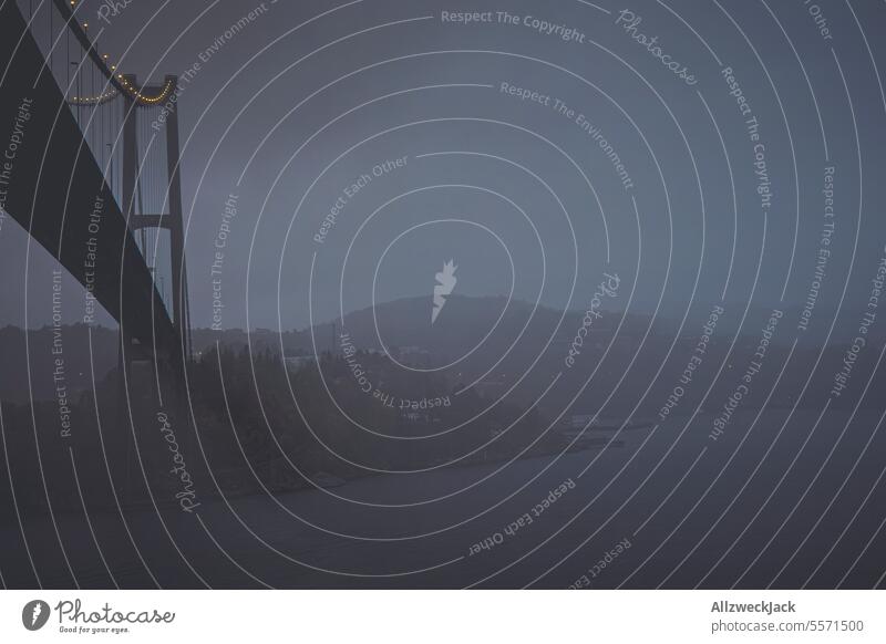 Askøy Bridge in Norway at night in fog and rain Suspension bridge Night Night sky hazy hazy weather foggy Rain Drizzle Comfortless Cold Wet Dark Colorless