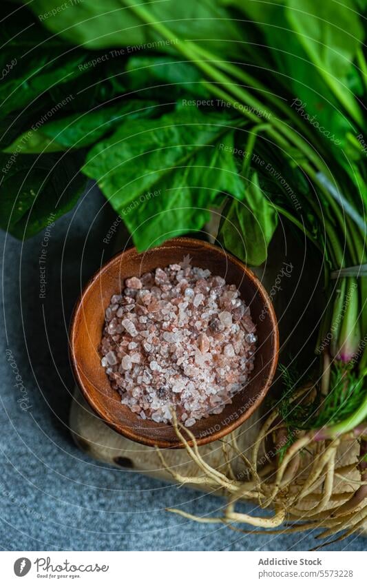 Fresh spinach and spices setup leaf salt vegetable bowl wooden rustic salad wholesome green aromatic fresh health nutrition ingredient food organic natural