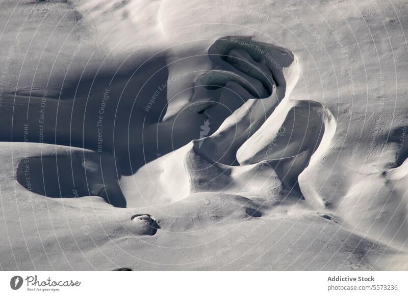 Snow covered landscape with abstract during winter day snow full frame covering sunlight view mountain peak top natural sunny travel nature beautiful scenery