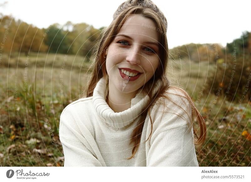 Young woman in a white wool sweater in a heath landscape in fall Woman Large tall woman Slim Bright Joy Landscape Northern Germany Athletic pretty Esthetic