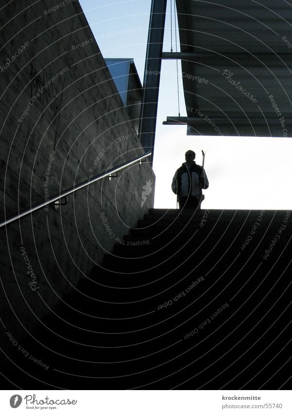 Where's the track? Skier Concrete Roof Man Snowsuit Back-light Playing Winter Stairs Train station Wait Handrail Silhouette