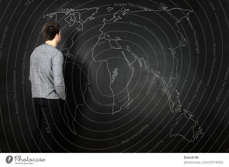 Man looks at the world and thinks about the future Map of the World Future Fear of the future War Meditative Geography Continents Earth Life Global Environment