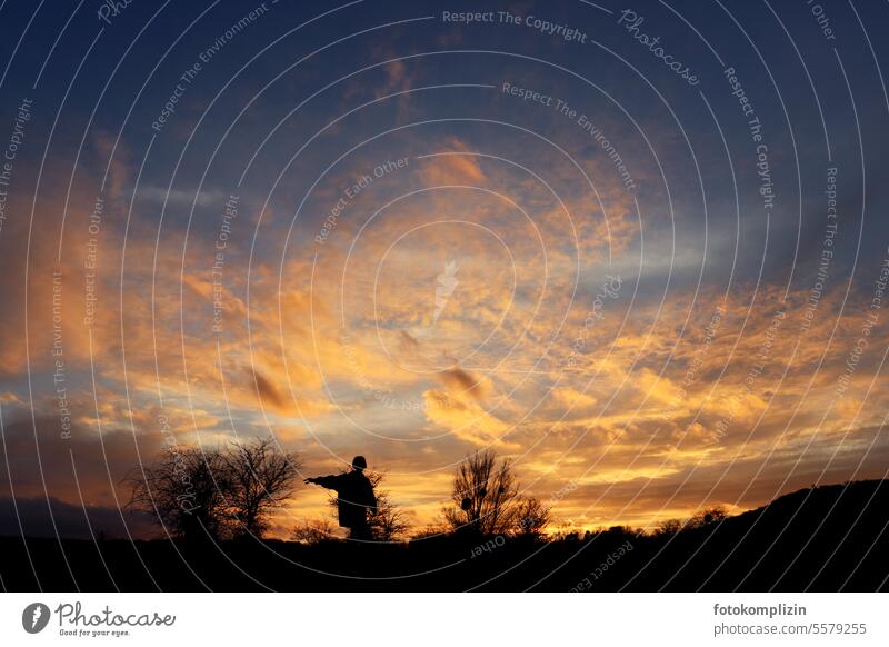 Silhouette of a person under an evening sky Human being Sky Orientation Sunset Nature Clouds Twilight Evening Dusk Dramatic Dramatic art Indicate Life