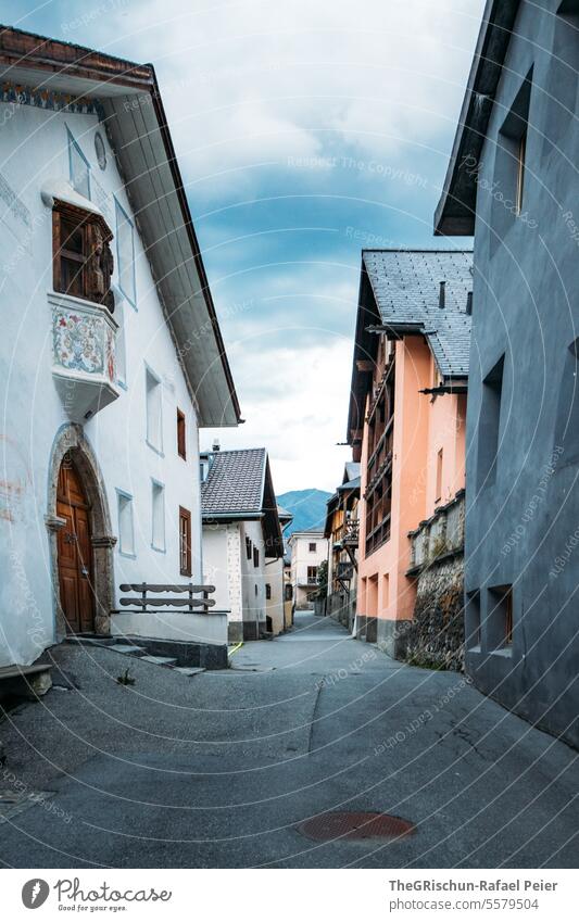 Mountain village at dusk with lights - Sent Village Moody Dusk roofs sentinel Lower Engadine Switzerland Alley Street houses ornaments Engadine house