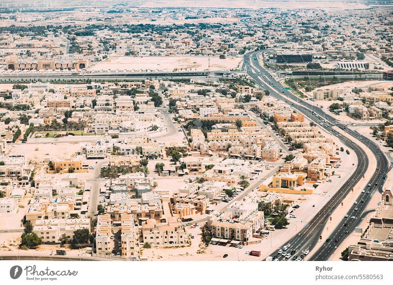 Aerial View Of Cityscape Of Dubai From Window Of Plane. Traffic In Residential District. United Arab Emirates Birds-eye View UAE aerial aerial view area asia