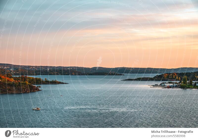 View from the cruise ship on departure from Oslo Norway Scandinavia Cruise Landscape Nature Islands Ocean Baltic Sea Sky Clouds sunset Sunset Water Waves boat