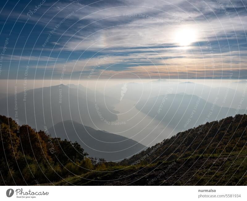 From above the world Alps Clouds mountain lake Lake Italy Switzerland Austria Sunset height on Horizon Peak Mountaineering Forest Mountain forest Looking Nature