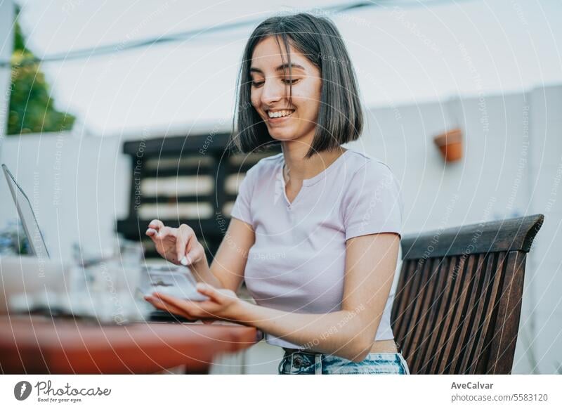 Woman smiling while holding many pills in her open hand, she is about to eat them, supplementing woman happy painkiller vitamin healthy student smart using