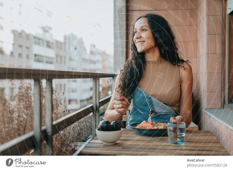 Diverse freelancer woman working on laptop and eating salad,healthy people, working at home concept. pill supplement happy painkiller vitamin indoor lady