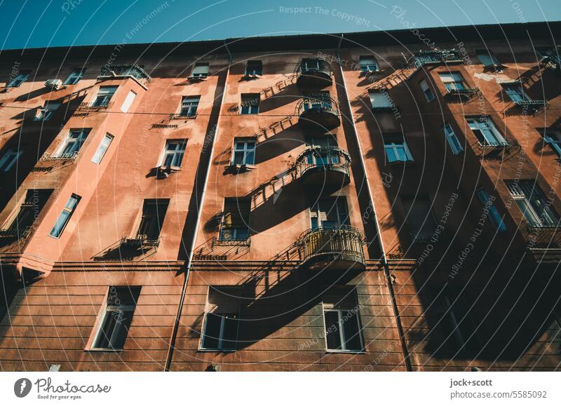 Lots of sunlight in front of the balcony Facade Balcony long shadow Sunlight Architecture Worm's-eye view Contrast Authentic Style Silhouette Oriel