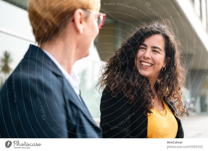 Friends businesswoman working using laptops together outside the office. Working process project outdoors colleague women female person happy attractive smile