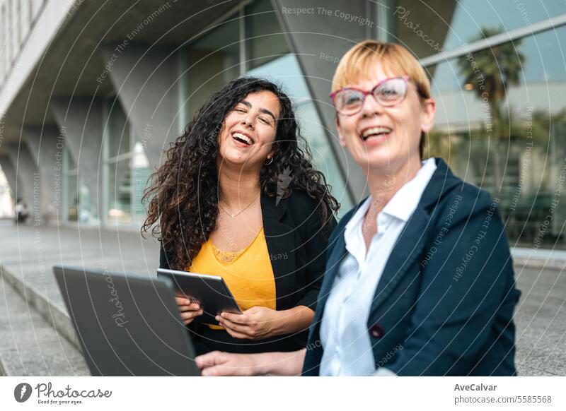 Business people in financial district, diverse colleagues working near office building using laptop outdoors person business computer businesswoman sitting