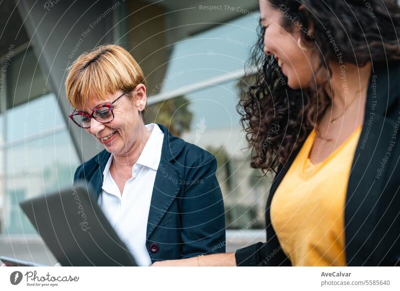 Friends businesswoman working using laptops together outside the office. Working process project outdoors person women colleague teamwork caucasian