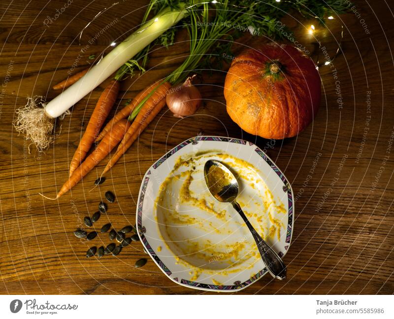 Delicious pumpkin soup in fall tasted good. Empty plate and the ingredients. Pumpkin soup empty plate Eaten Full it tasted good all empty It was good