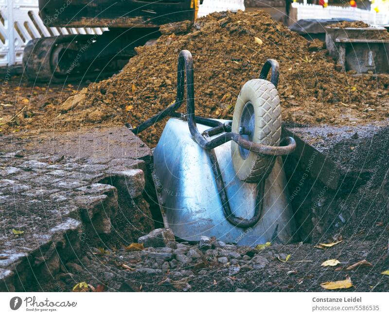 Wheelbarrow, upside down on a road construction site Construction site labour Work and employment Build Exterior shot Craft (trade) Craftsperson Workplace