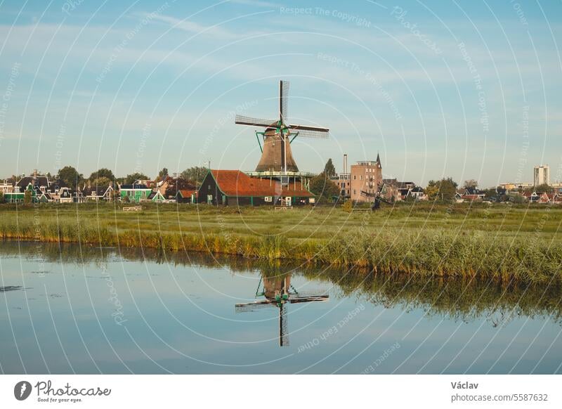 Popular tourist spot Zaanse Schans is near Amsterdam in the west of the Netherlands. Historical, realistic windmills during sunrise. Holland's landmark