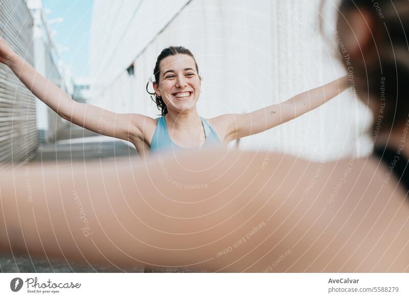 Young women doing some marked exercises outside the home, jumping and exercising their muscles. female fitness young person sport workout lifestyle training