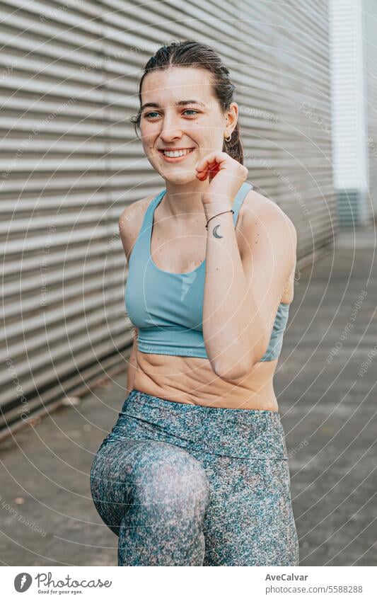 Young women doing some marked exercises outside the home, jumping and exercising their muscles. female fitness sport person lifestyle young beauty athletic body