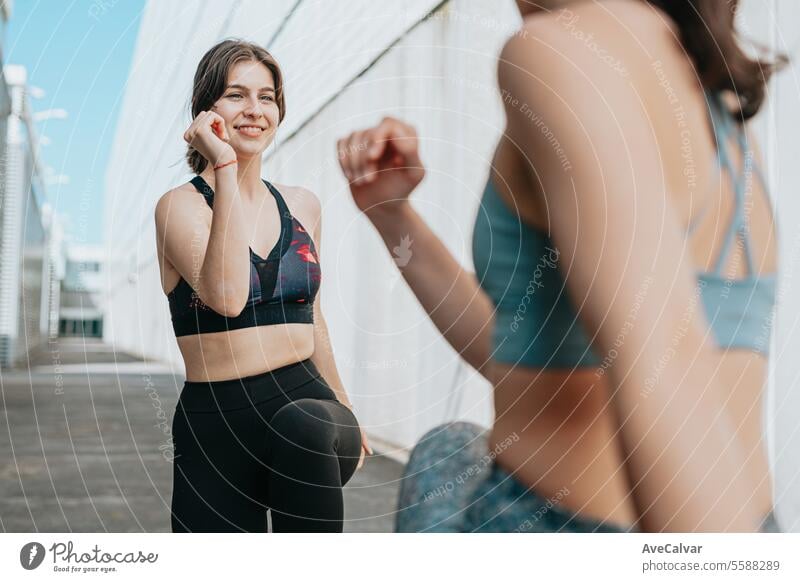 Young women doing some marked exercises outside the home, jumping and exercising their muscles. sport female fitness person training lifestyle athletic outdoor