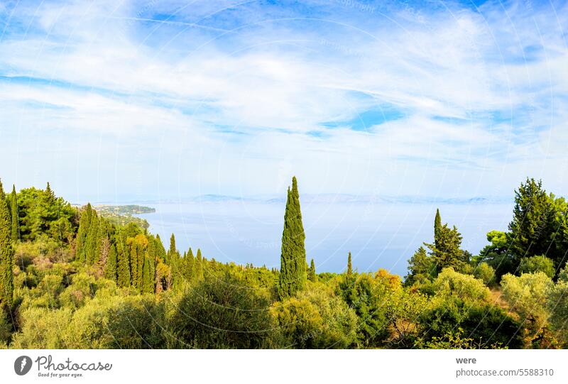 View from the former villa of Empress Sissi Achilleion over forests of cypress and olive trees to the city of Corfu Beaches Byzantine churches Corfu Town