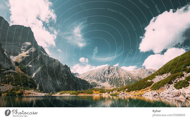 Tatra National Park, Poland. Calm Lake Czarny Staw under Rysy And Summer Mountains Landscape. Beautiful Nature, Scenic View Of Five Lakes Valley. UNESCO World Heritage Site