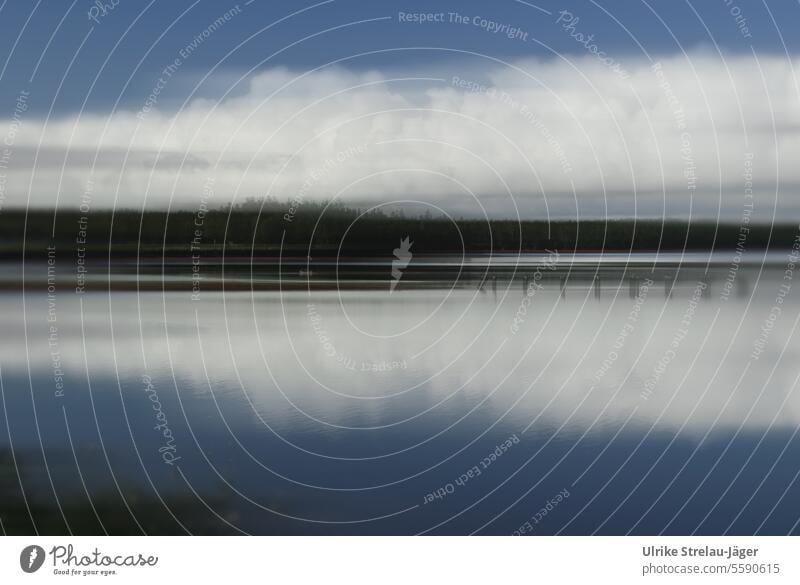 Canada | Lake in soft light with reflection of white clouds bank Lakeside Reflection Calm Water Water reflection Surface of water Peaceful White Clouds