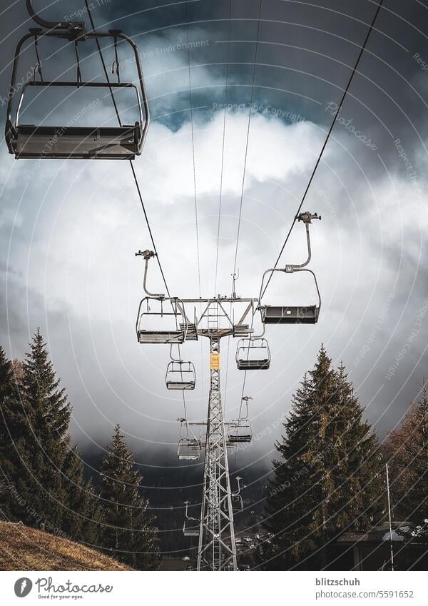 A chairlift awaits the winter season chair lift Armchair Ski lift Holiday season Winter Autumn Mountain Sports Vacation & Travel Winter sports Sky Snow