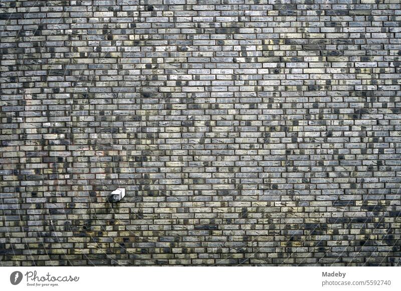 Large-scale old clinker brick façade on Hanauer Landstrasse in the Ostend district of Frankfurt am Main in Hesse line course Progress Surface metropolis