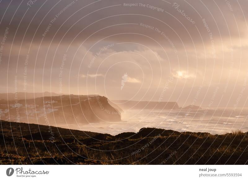 Cliffs in the dramatic evening light of a storm Nature Landscape coast Ocean Moody Gale Waves Surf cliffs panorama Wild stormy Clouds in the sky sunset Deserted