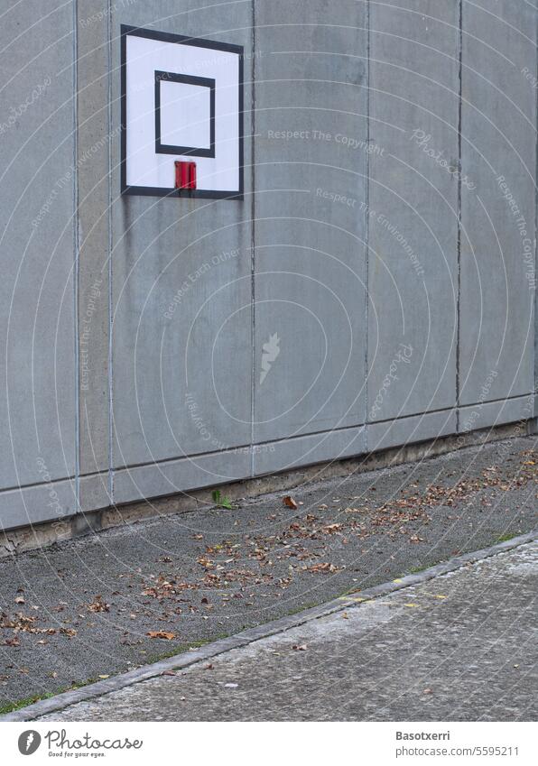 Marking for basketball hoop on a concrete wall on an asphalt surface Basketball Basketball basket missing Concrete Concrete wall Asphalt Basketball arena street