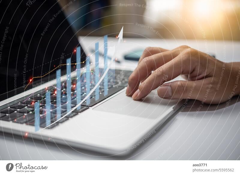 Businessman analyze financial data chart of statistics and graph with arrow. Business strategy development and growing growth plan. business laptop technology