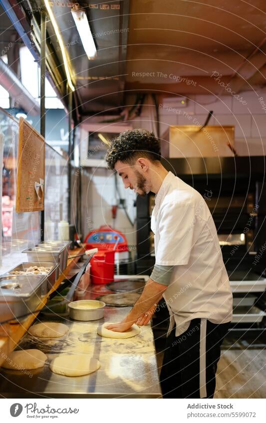 Pizza man making pizza shape portrait arabic baker dough kneading shaping bakery flour work cook traditional baking preparation occupation muslim food kitchen