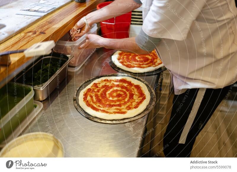 Baker's hands taking ham from container pizza man food pizzeria ingredients tomato sauce restaurant kitchen preparing italian cooking baker person meal