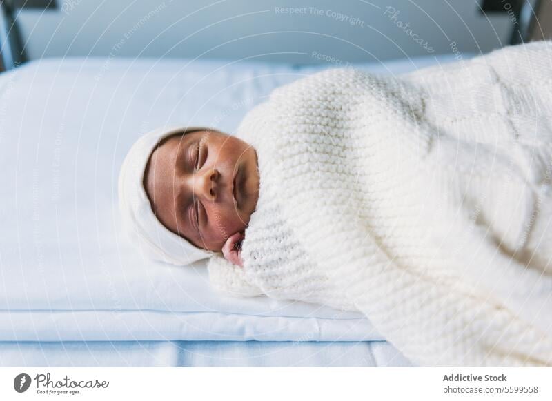 Newborn baby sleeping in his crib at the maternity hospital ward. newborn room peaceful innocence softness beginnings comfortable relaxation resting cozy