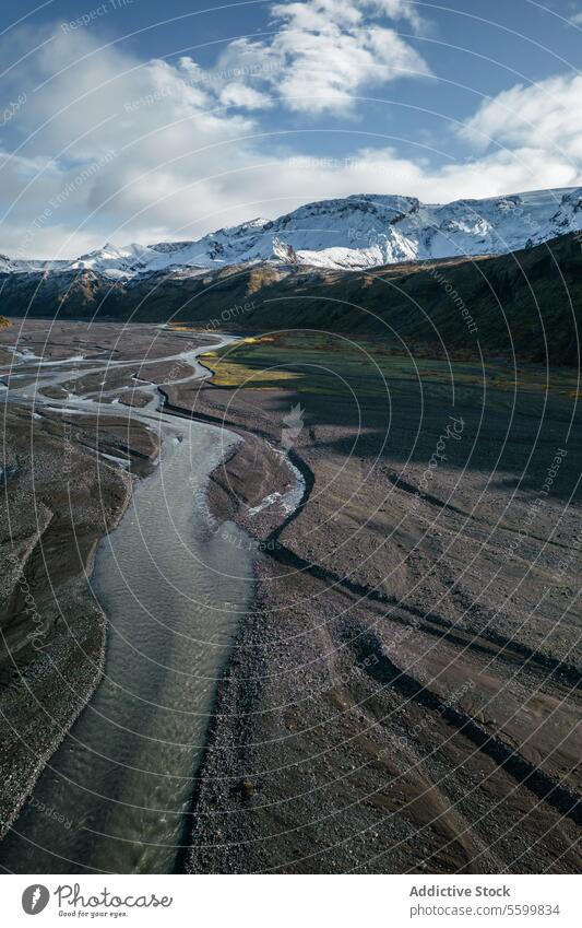 Thorsmork Valley river and snowy mountains peaks shot meander valley background sky cloud Icelandic highland landscape nature outdoor scenic beauty tranquil