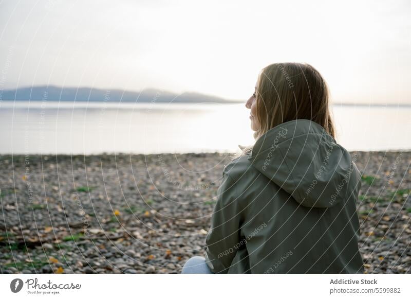 Side view of woman looking away against lake person female young nature water adult portrait leisure lifestyle happy one standing caucasian vacation lonely face