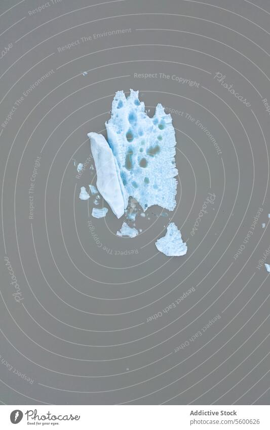 Blue Iceberg in Glacial Lagoon aerial shot iceberg blue texture floating glacial lagoon Vatnajökull National Park Iceland murky water natural wonder cold arctic