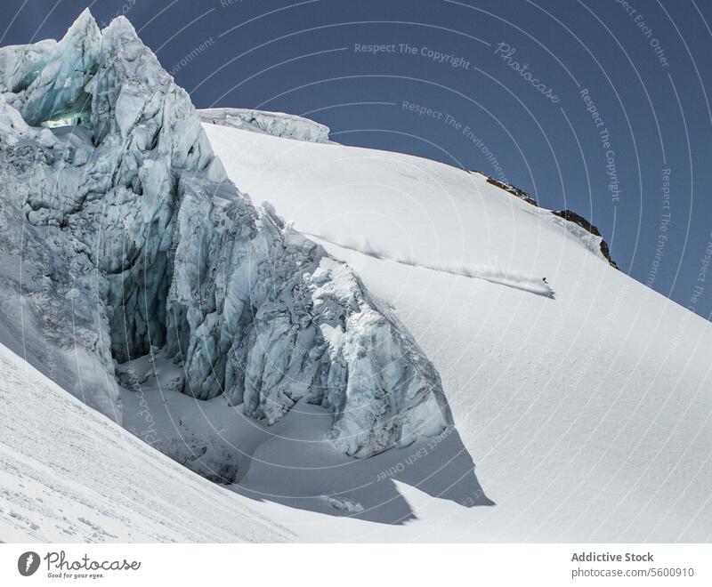 Unrecognizable person skiing on snow mountain during vacation at Swiss Alps during sunny day skier enjoy winter covering swiss alps unrecognizable white