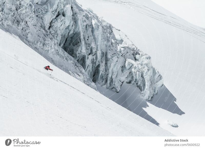 Unrecognizable person skiing on snow mountain during vacation at Swiss Alps during sunny day skier enjoy winter covering swiss alps unrecognizable white