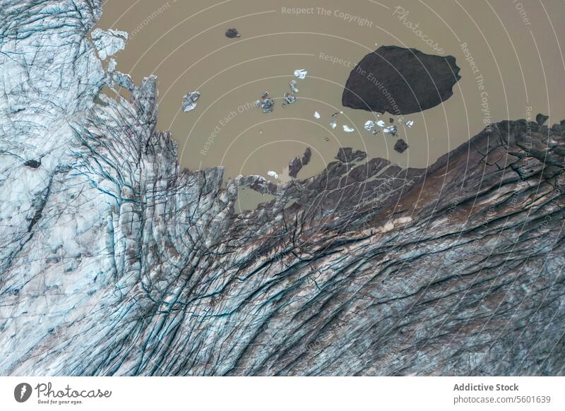 Aerial view of ice cap and sea with icebergs glacier aerial landscape winter weather nature scenic arctic cold water seaside vatnajokull iceland texture