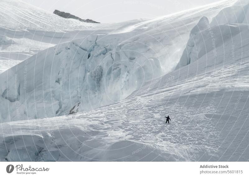 Person snowboarding on snowy highland in vacation person mountain swiss alps unrecognizable from above ride snowboarder majestic beauty covering winter sunlight