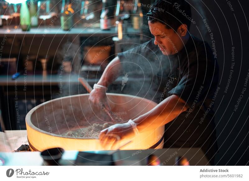 Sushi chef preparing fresh ingredients at sushi bar restaurant preparation cooking cuisine japanese dish focused food culinary knife work professional skill