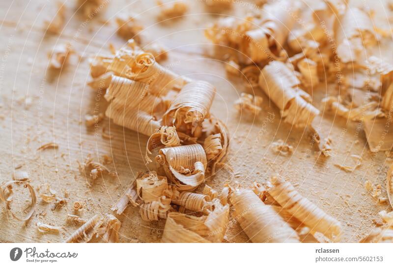 wood shavings in variety of sizes on a table old-fashioned carpenter tools carver blade workshop antique carving equipment handmade wooden timber carpentry