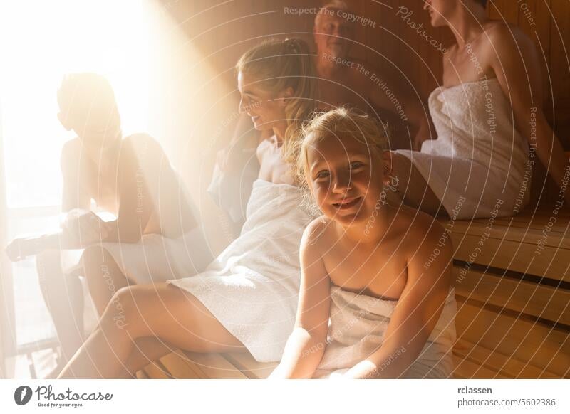 Happy couple enjoying the sauna together at the spa. Steam in saun room, spa and wellness concept, relax in hot finnish sauna. blond child old harmony friends